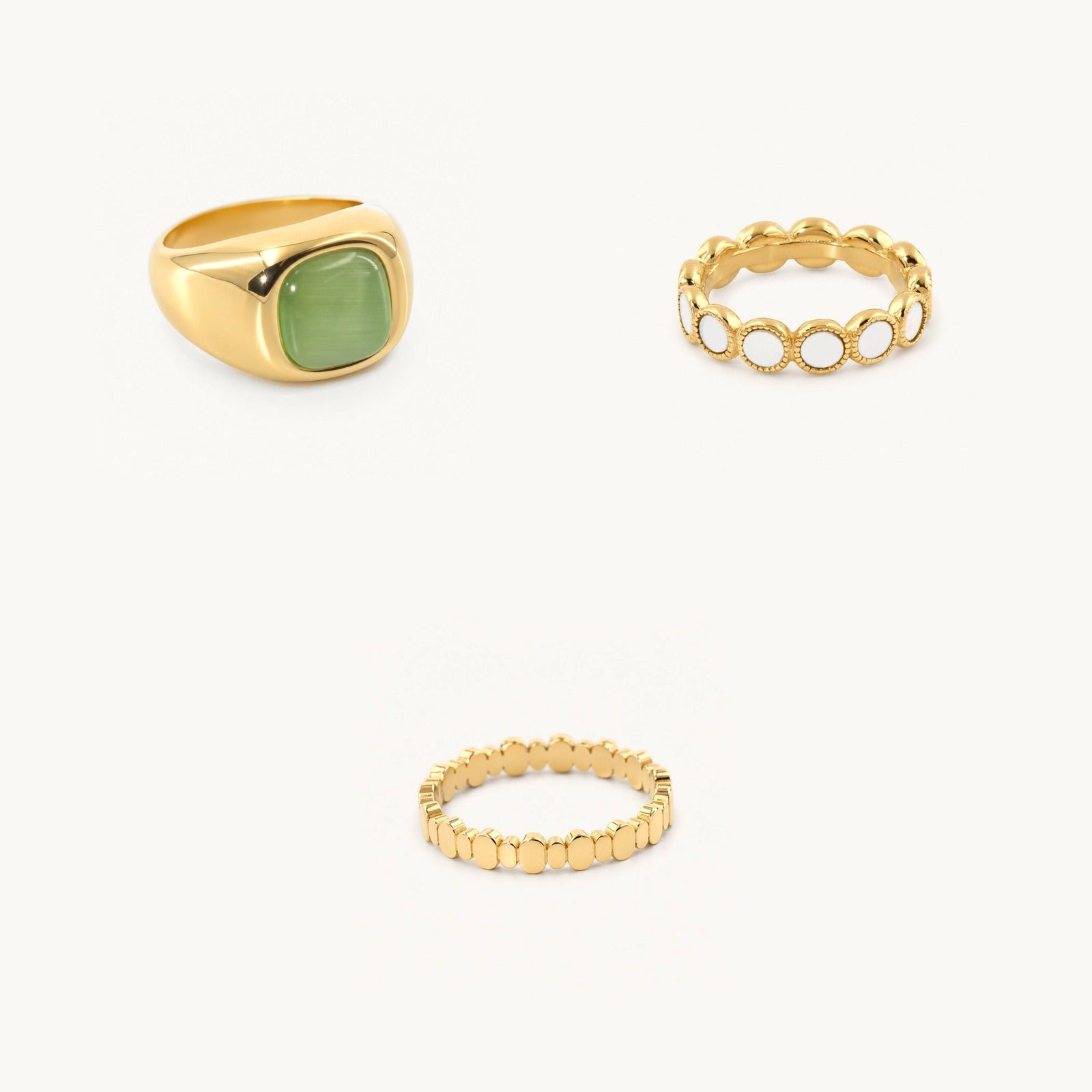 Meridian Ring Stack: Green cat’s-eye signet · mother-of-pearl ring · dotted flat band